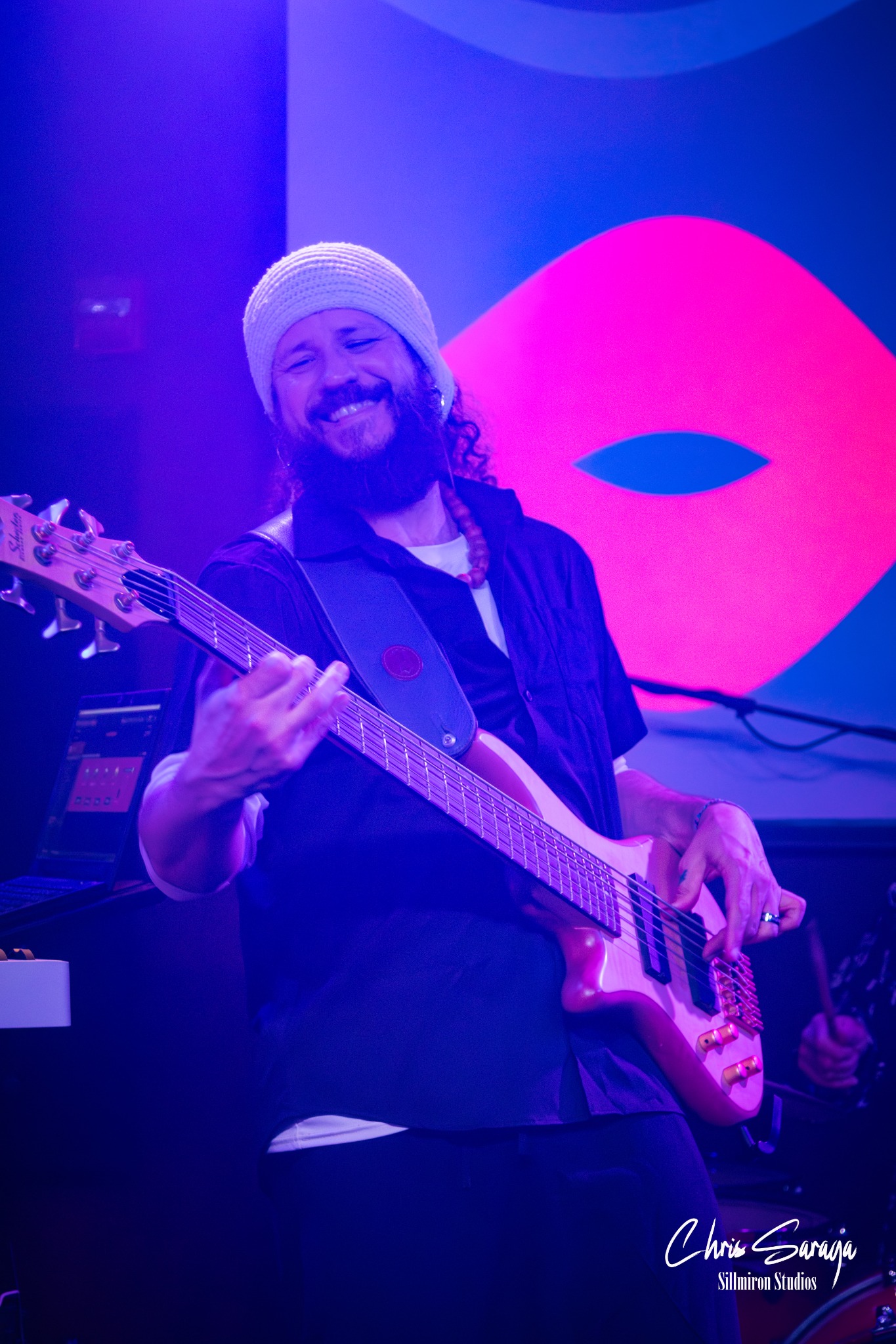 Isaac Oriola performing on bass guitar